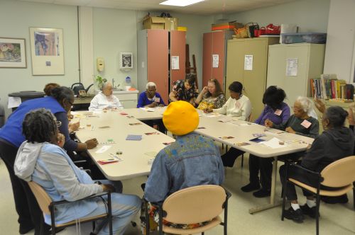 Participants in the Benjamin Rose Institute on Aging’s Adult Day Program paint greeting cards to share with family and friends