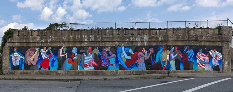 Lynnea Holland-Weiss Love Hustle Slide and Dip mural near the E. 34th Street Campus Rapid Station