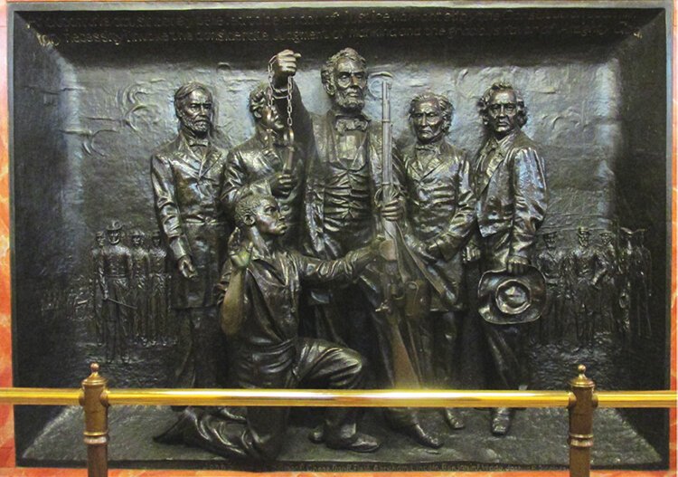 “The Emancipation of the Slave” cast bronze relief panel is embedded in the north side of the shaft’s foundation in the interior of the Tablet Room.