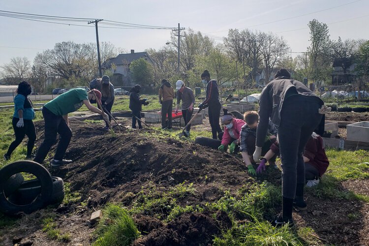 FoodStrong volunteer cleanup event at the Coit Road Farmers Market