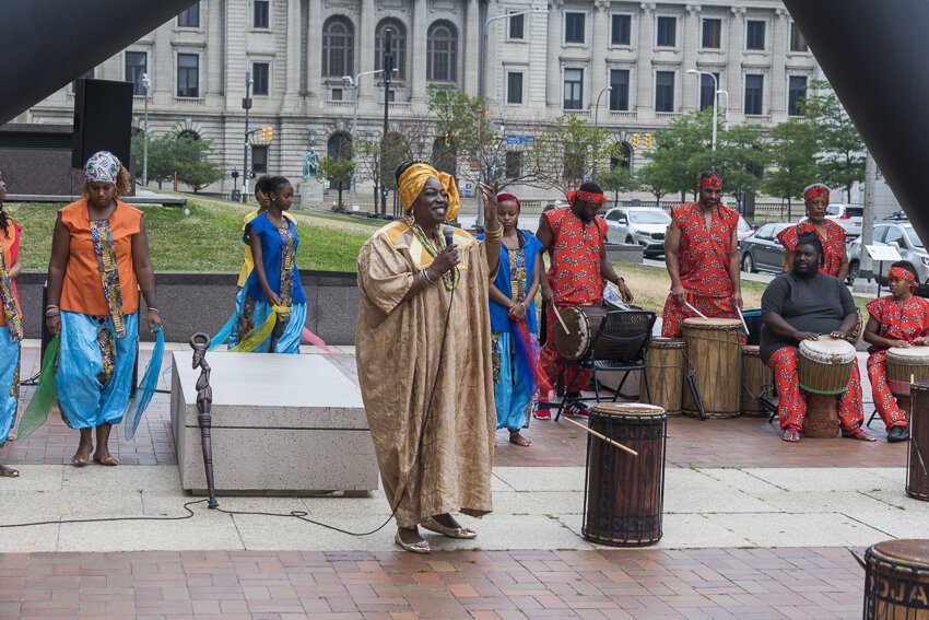 Sculptor Isamu Noguchi, Portal is a thirty-six-foot-tall black tubular steel sculpture outside the Cuyahoga Justice Center that was miked for sound and included a performance with Joe Namy and Djapo Cultural Arts.