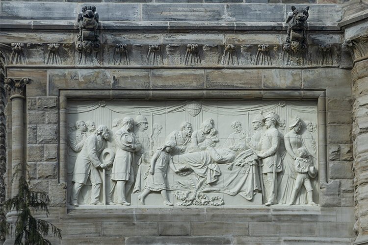 Depiction of Garfield’s death bed on the side of the Garfield Memorial at Lake View Cemetery