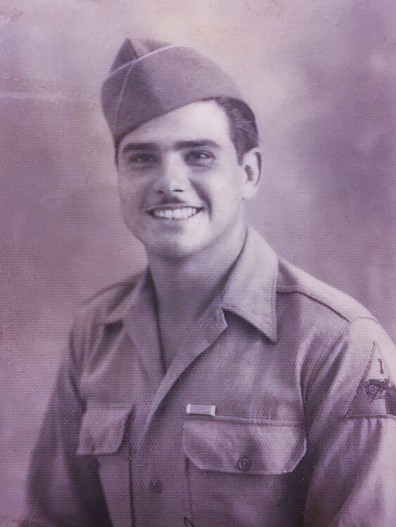Frank Matowitz, age 21, September 1943, above his pocket is the ribbon for his Purple Heart.