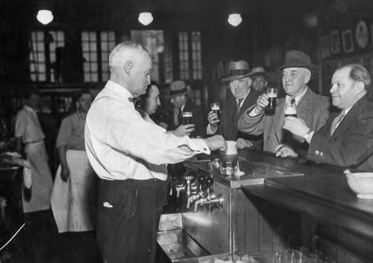 Otto Moser serves a group of "regulars" in 1940