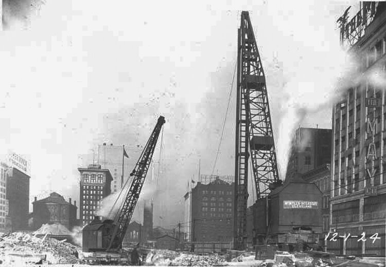 Looking north from Champlain St. at pile driver and crane used in excavating the wall along the west side of Ontario St. - 1924