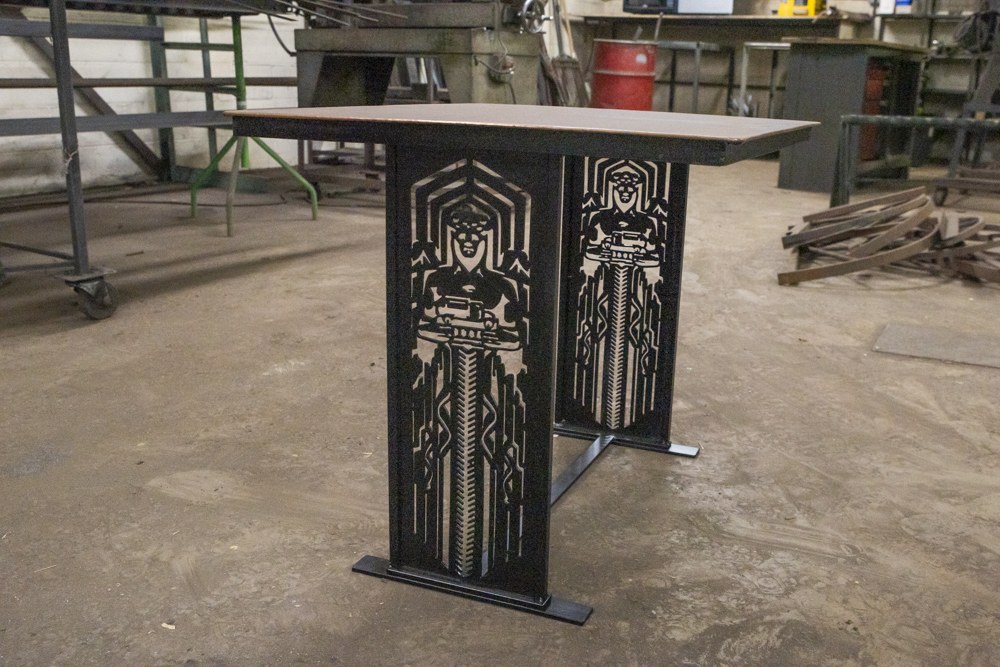 One of Paul Hadley's ironwork pieces, a table featuring the Cleveland Traffic Guardians
