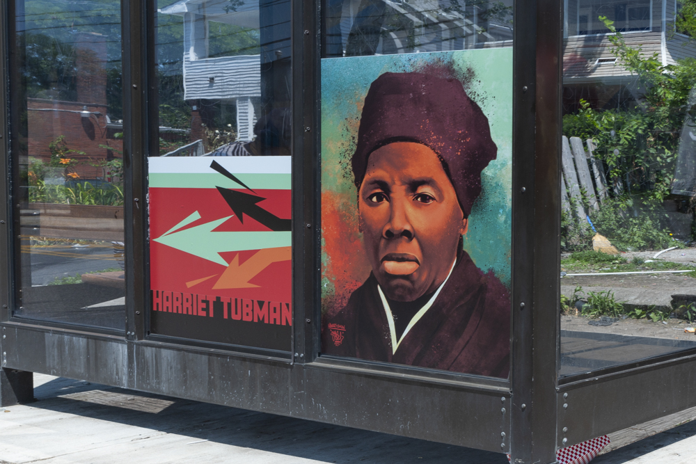 Bus stop art by mr. soul at E 131st and Harvard north bound