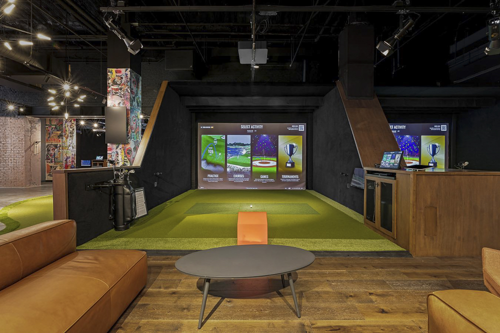 Five Iron Golf on the first floor of the Euclid Grand Apartments