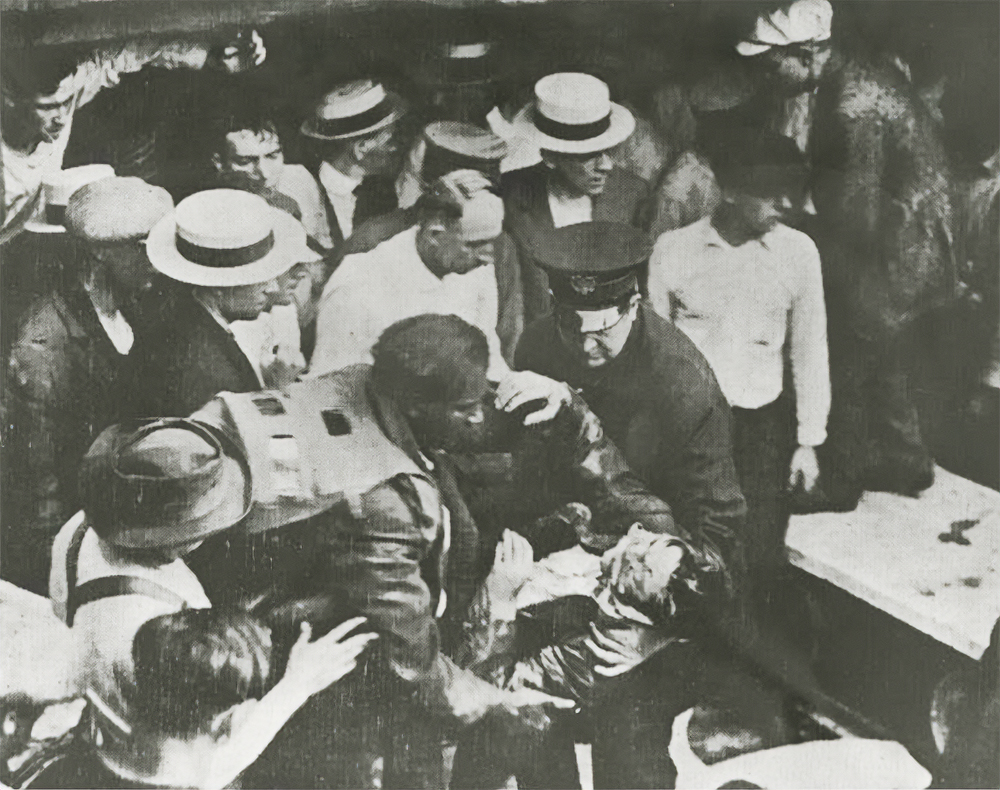 Garrett A. Morgan bringing a victim ashore