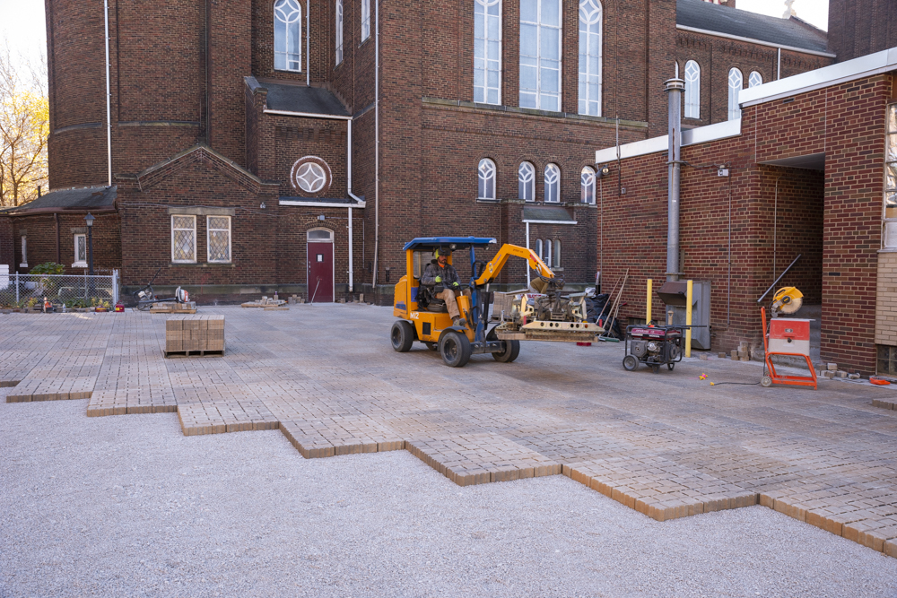 Permeable pavers in a parking being laid down at St. Casimir Church