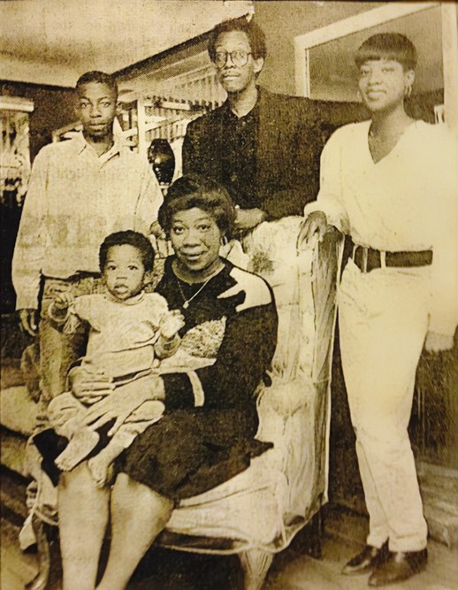 Morris Ervin Sr., standing center, with wife Pat Ervin, seated and their children, Morris Jr. - age 14, standing left, Erica, standing right and Elias, seated in their University Hts. home