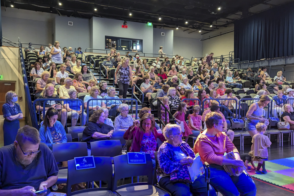 An audience of 300 children and adults gets ready to hear Connie
Schultz's children's book