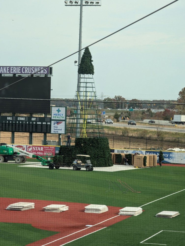 Assembling the 52-foot animated tree at Crushers Stadium