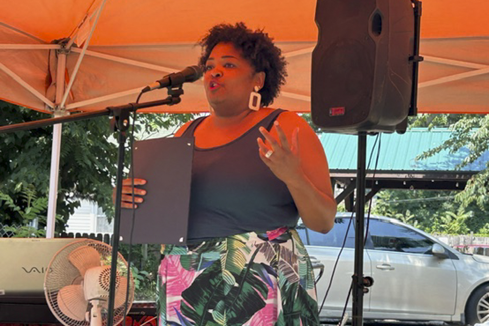 Councilwoman Stephanie Howse-Jones, Cleveland City Council, delivers proclamations from the City of Cleveland at the St. Clair-Superior Pocket Park opening