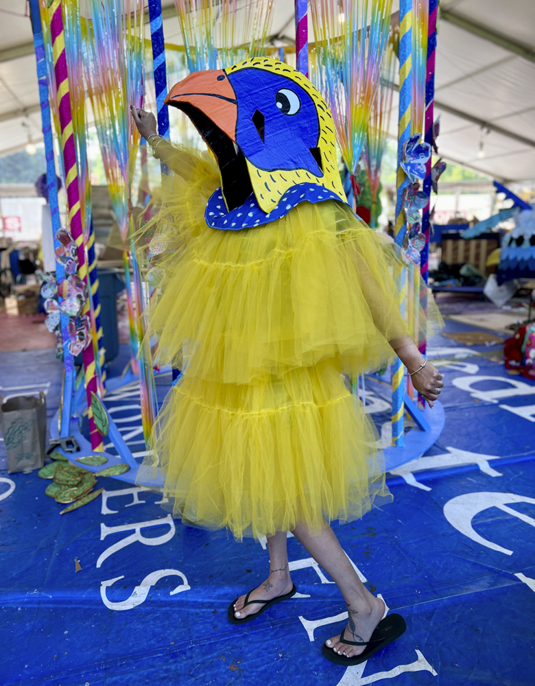 Artists, volunteers, and parade participants putting the final touches on the costumes, puppets, and floats for this year’s Parade the Circle “Visions of Harmony”