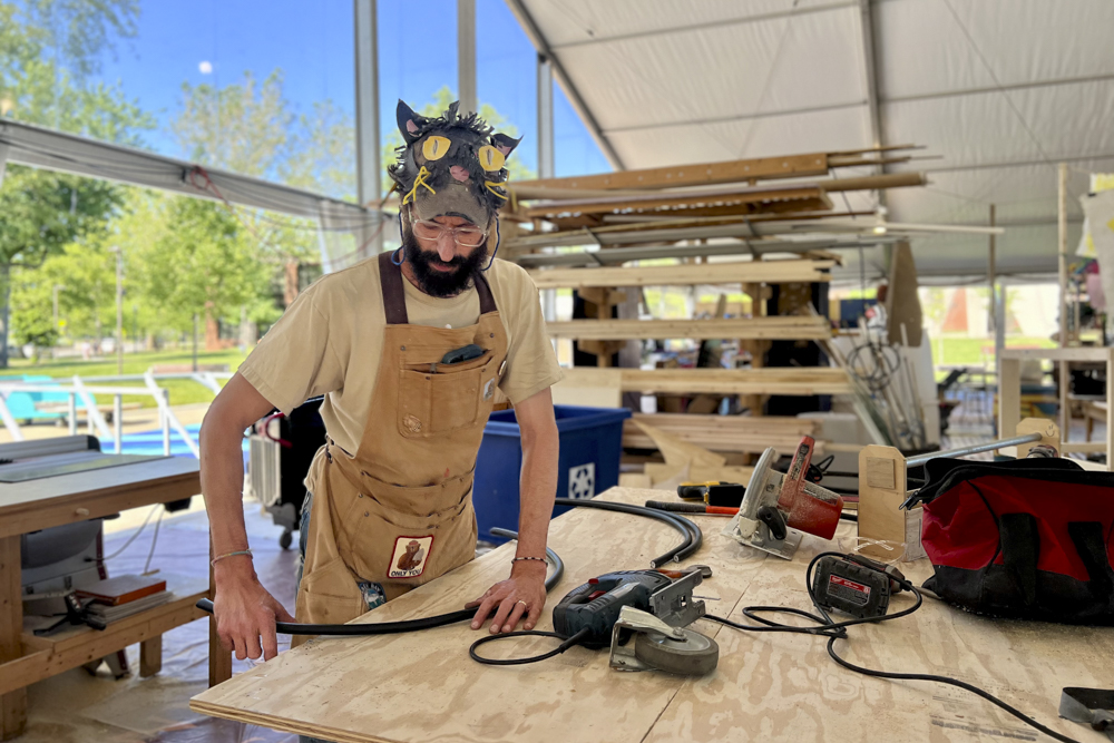 Artists, volunteers, and parade participants putting the final touches on the costumes, puppets, and floats for this year’s Parade the Circle “Visions of Harmony”