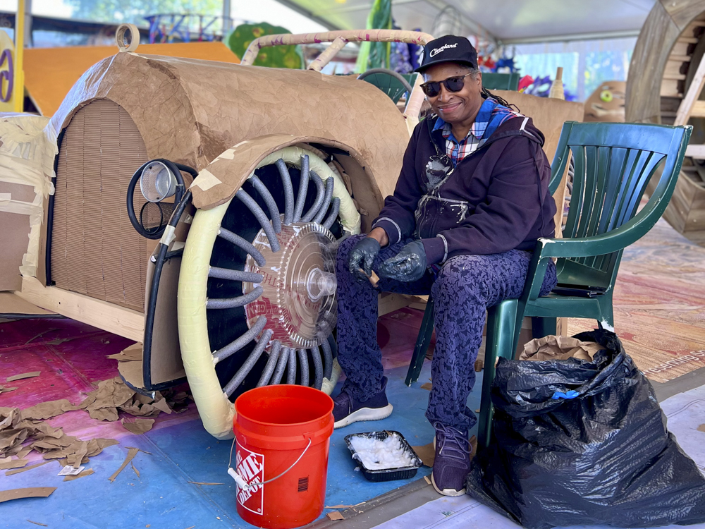 Artists, volunteers, and parade participants putting the final touches on the costumes, puppets, and floats for this year’s Parade the Circle “Visions of Harmony”