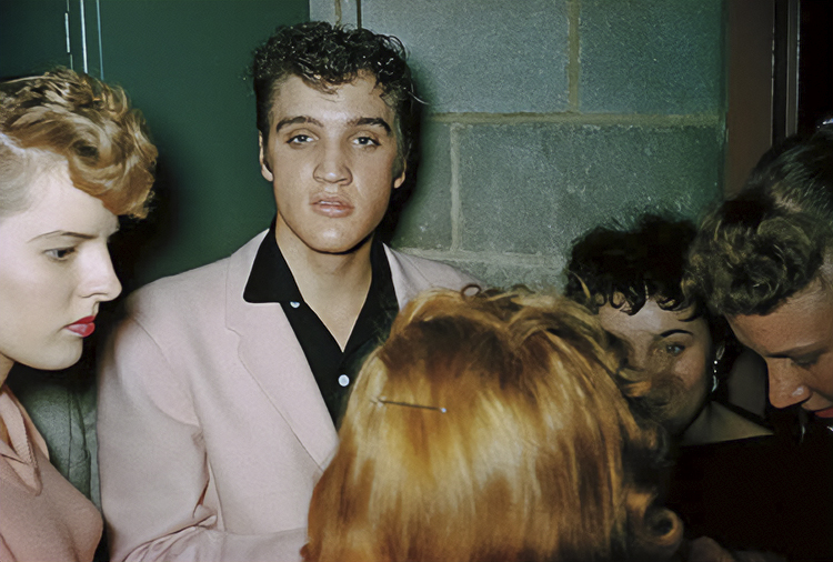 Elvis Presley signing autographs backstage at St. Michael's Hall in Broadview Heights, October 20, 1955