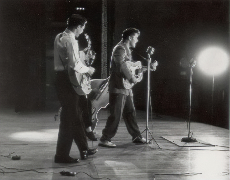 Elvis Presley, right, at Brooklyn High School in 1955