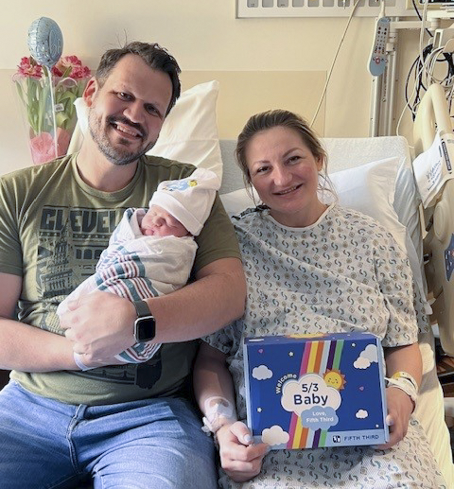 Parents of a newborn at University Hospitals MacDonald’s Women’s Hospital accepting the Fifth Third Babies gift on May 3