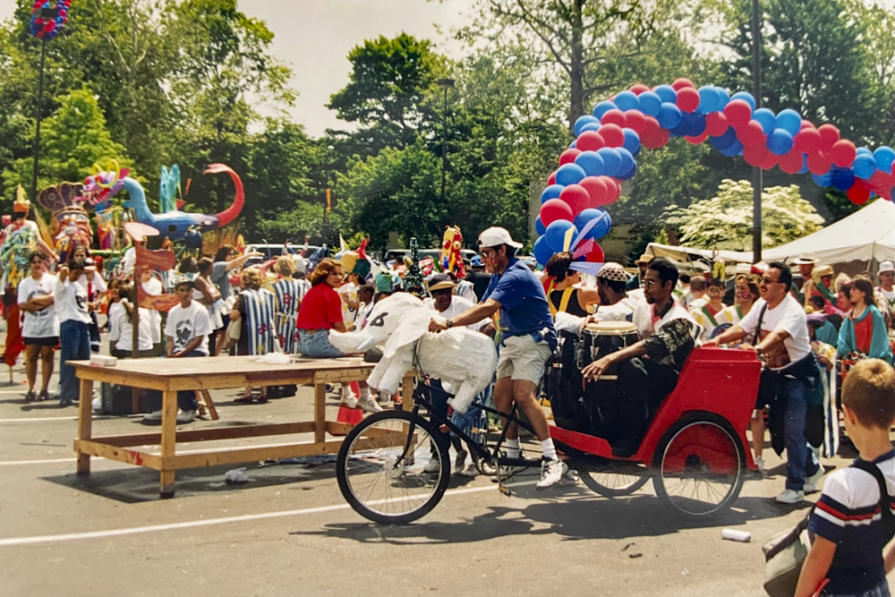 Hector Castellanos riding the bike with the white elephant at Parade the Circle in 1998