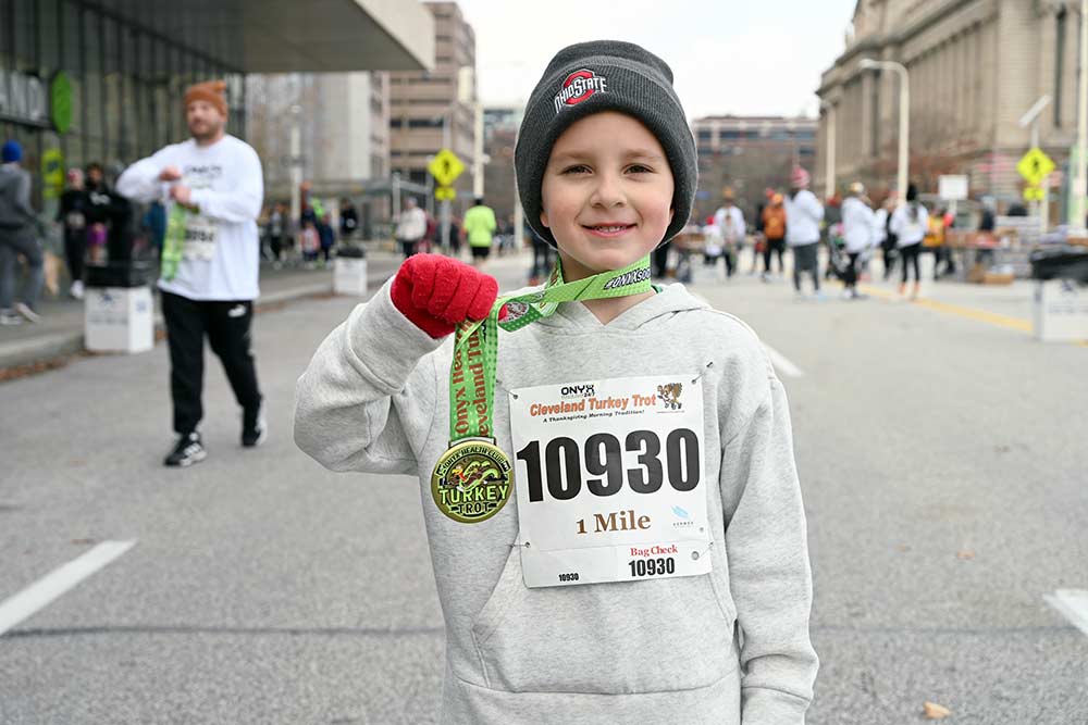 A young Turkey Trotter shows off her medal, 2023