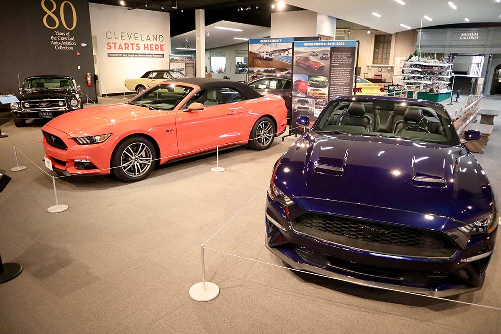Like all Mustangs, convertibles are offered with a variety of engine configurations. The 2019 (left) with a 5.0 liter V-8; the 2015 (right) with a 2.3 liter turbocharged inline 4-cylinder.