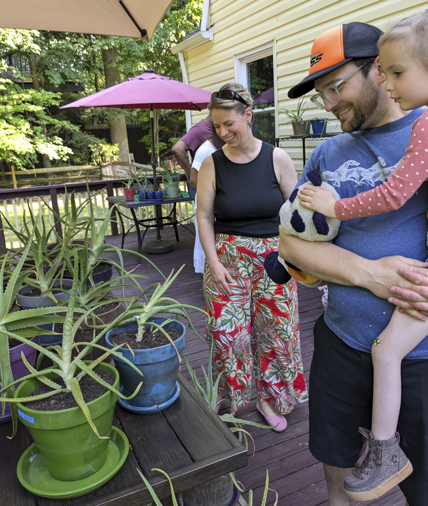 Lena's neighbors Suzie and Ben with daughter Claire