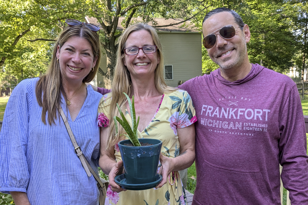 Jon and Erika Leiken with Lena at Open House with the plant they purchased