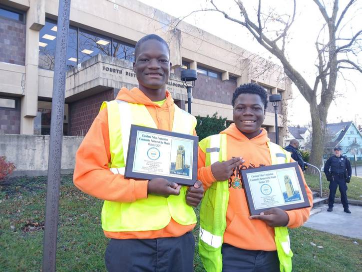 The Trash Boys named Community Partner of the Month. The plaques say, "The Cleveland Police Foundation would like to honor The Trash Boys Helping make the City of Cleveland a safer place to live, work, play, and raise a family."