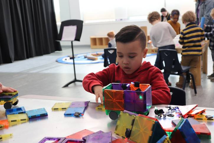A child is focused on his work during a recent STEAM Saturdays at the Music Settlement, where kids participate in a variety of hands-on activities.