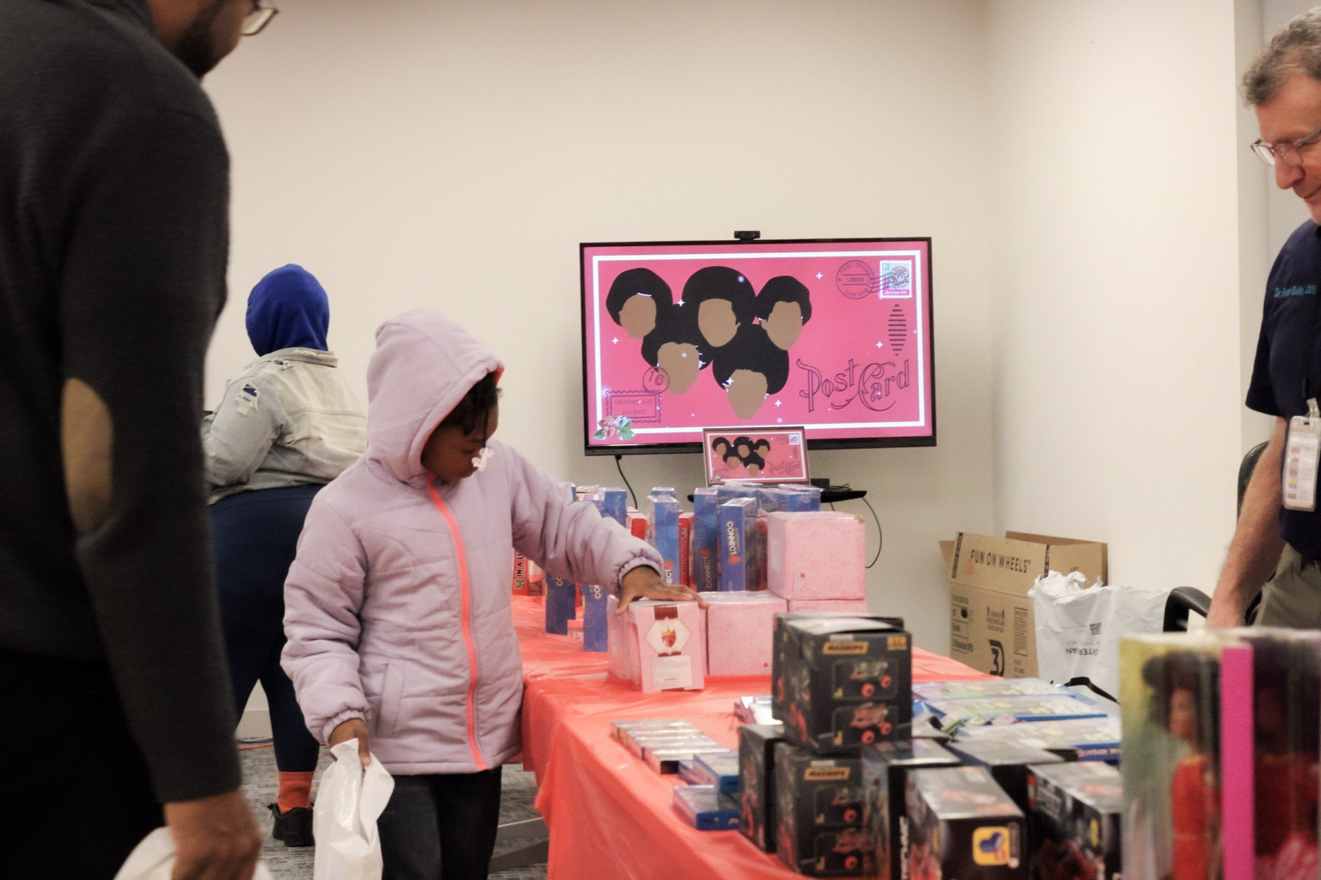 A young girl selects her toy from the Toy Giveback.