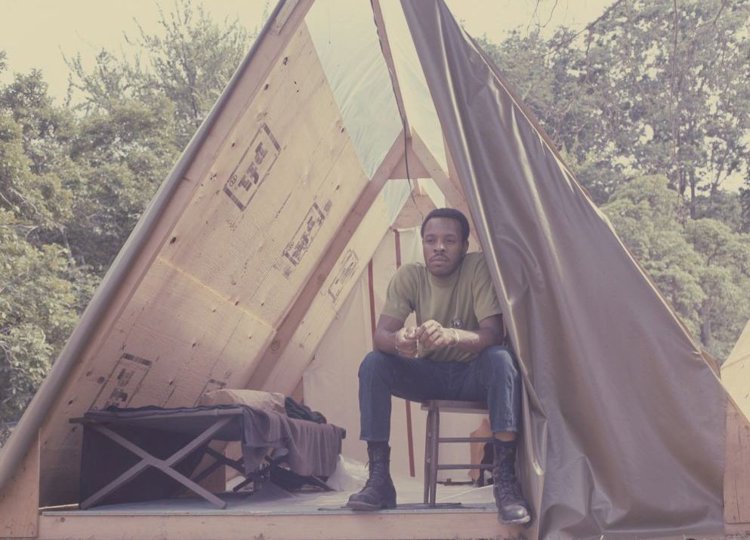 Man sitting inside a tent at Resurrection City.