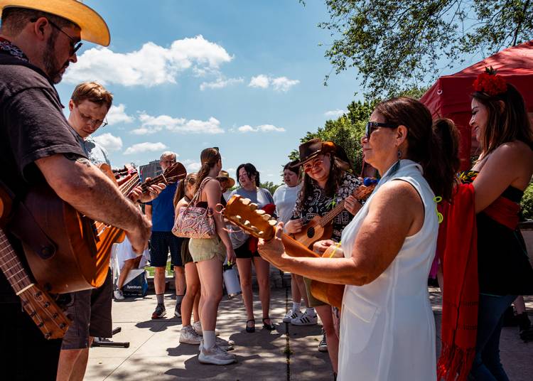 Musicians with AlmaVision: Cultura y Más filled the Fine Arts Garden with Mexican folk music during Parade the Circle 2025.