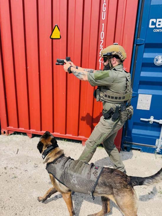 Officer Jeremy Puszakowski and K-9 Chinook run a firearm detection drill