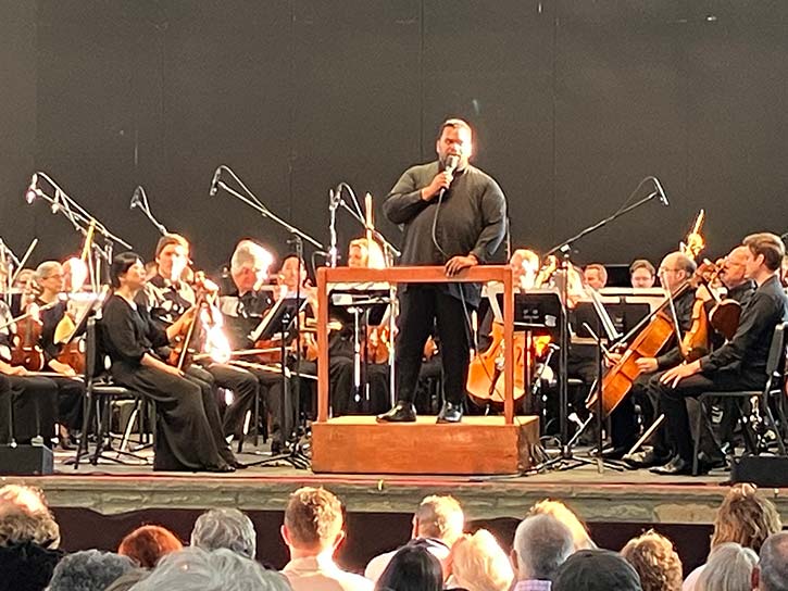 Anthony Parnther, music director of the San Bernardino Symphony Orchestra speaks to the audientce at Cain Park.