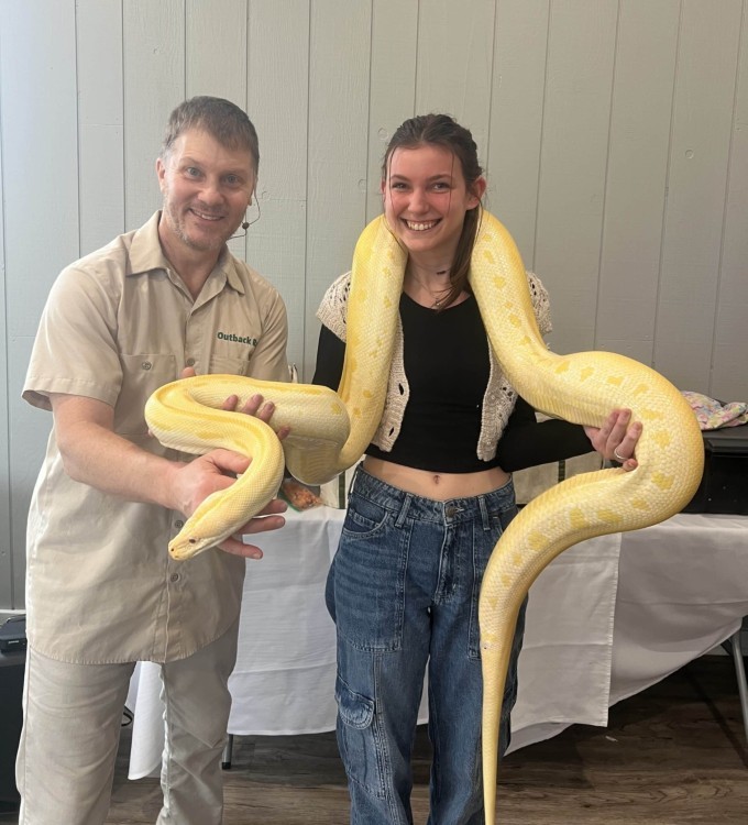 Outback Ray and Sky holding SpongeBob the albino Burmese python