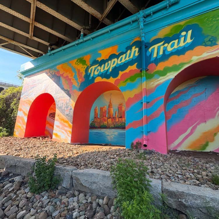 Schwab was selected from a pool of 70 artists  to paint the mural 4,000-square-foot mural that tells the story of Cleveland's evolution from industrial hub to recreational destination.