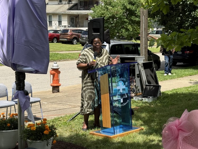 Black Environmental Leaders Board Chair Jocelyn Travis speaks  at the John Jordan marker dedication.