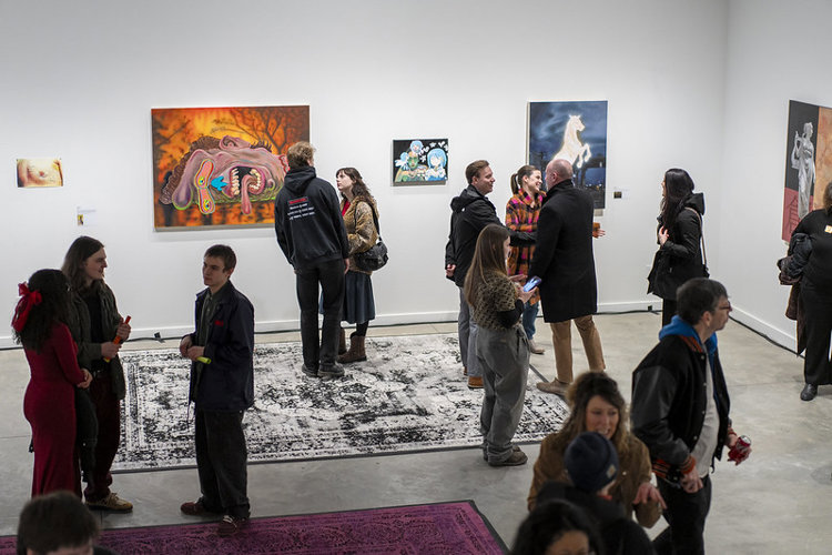 Guests enjoy the artwork on opening opening night