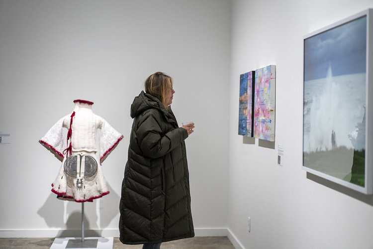 Guests enjoy the artwork on the opening night