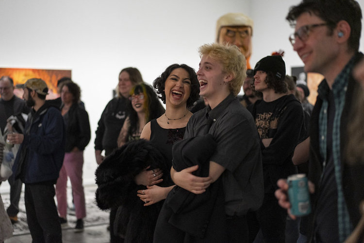 Guests enjoy the artwork on the opening night