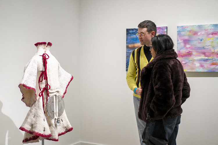 Guests enjoy the artwork on the opening night