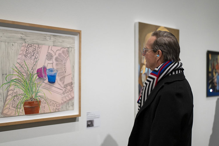 Transformer Station co-founder Fred Bidwell studies "Incantation" by CIA professor Amber Kempthorn