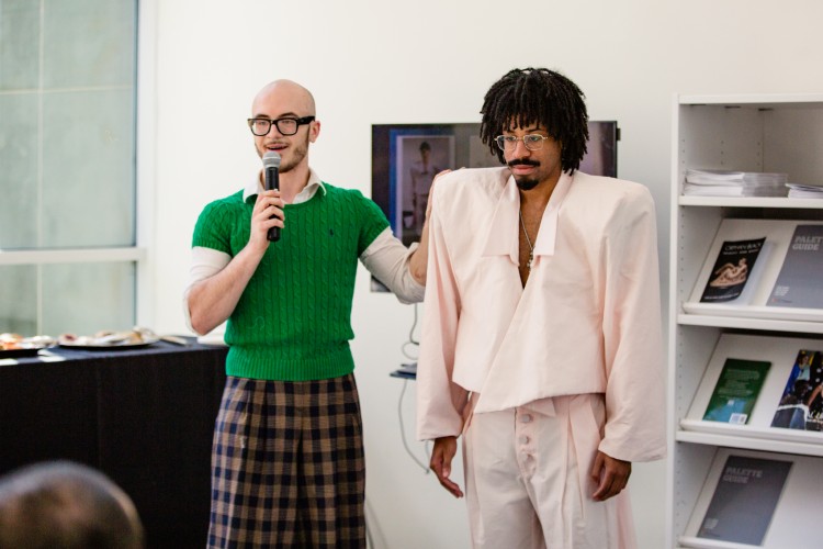 A KSU fashion design student presents a Salvador Dali-inspired garment to the panel of judges.