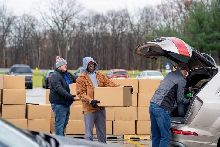 Volunteers with Catholic Charities, Diocese of Cleveland deliver turkey dinners on Thanksgiving.
