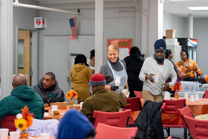 Community members enjoy Thanksgiving dinner at St. Augustine Hunger Center.