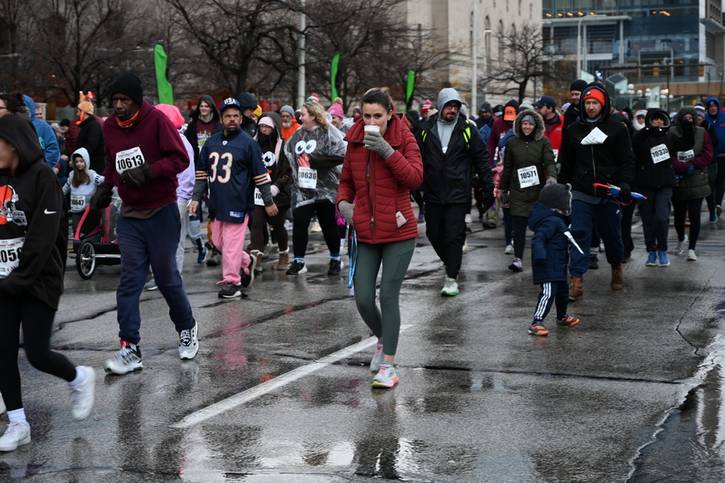 Staying warm with a coffee while on the Turkey Trot.