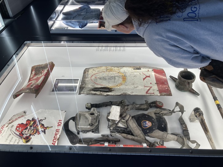 A visitor looks at 9/11 artifacts from the World Trade Center site.