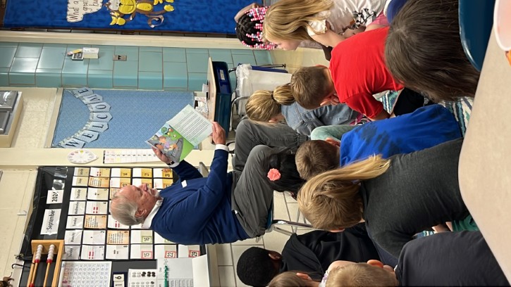 Author Dave Grunenwald reader his book to a group of children.